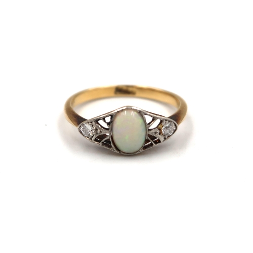 167 - An 18ct yellow gold hallmarked dress ring with oval opal to shoulder flanked by diamonds - ring size... 