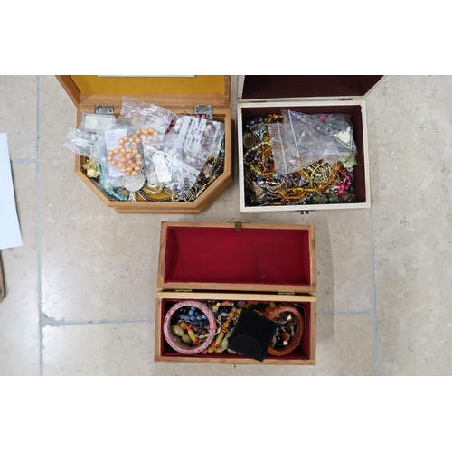 173 - Three boxes of costume jewellery - items include rings, beaded necklaces, brooches etc