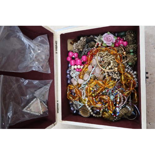 173 - Three boxes of costume jewellery - items include rings, beaded necklaces, brooches etc