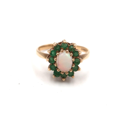 223 - A 9ct yellow gold dress cluster ring with green paste set around a central oval opal - ring size N -... 