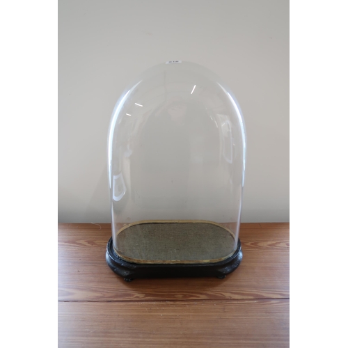 516 - A glass clock dome with base - Height 50cm x Width 34cm x Depth 20cm