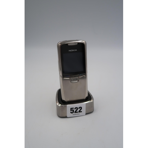 522 - A Nokia 8800 slide special edition silver stainless steel body with docking station - in good condit... 