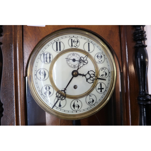 617 - A walnut cased single weight Vienna wall clock, Arabic numerals to white enamel dial, subsidiary sec... 