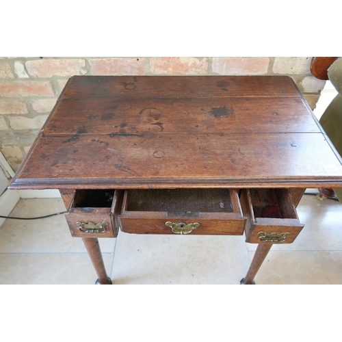 650 - An antique oak low boy on turned legs - some older restorations, maybe replaced top - Width 84cm x H... 