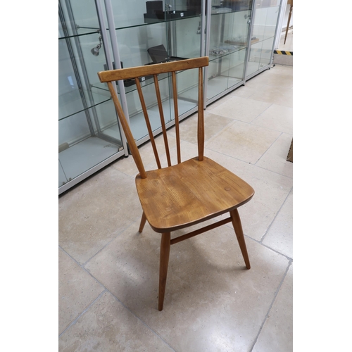 694 - An Ercol blonde table and four chairs - Width 75cm x Length 152cm x Height 72cm