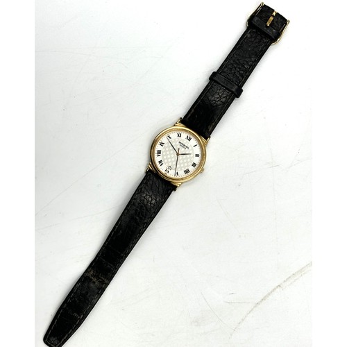 258 - A Raymond Weil gents wristwatch with date aperture on a leather strap - in working order