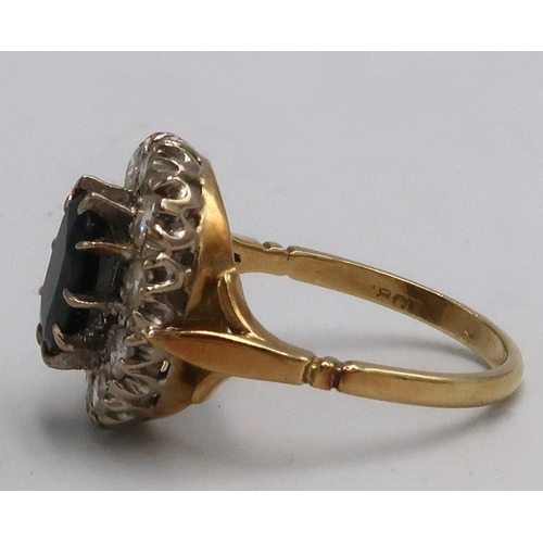  An oval sapphire and diamond cluster ring, estimated total diamond weight 1ct, stamped 18ct 750, siz... 