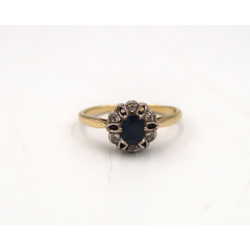  An 18ct yellow gold sapphire and diamond cluster ring, size P/O, approx 2.7 grams