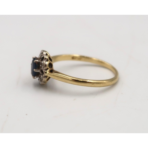  An 18ct yellow gold sapphire and diamond cluster ring, size P/O, approx 2.7 grams