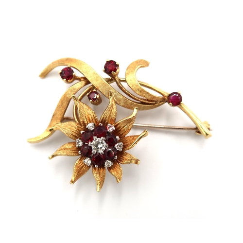  An 18ct hallmarked yellow gold foliate decorated brooch, cluster of garnets and diamonds to central ... 