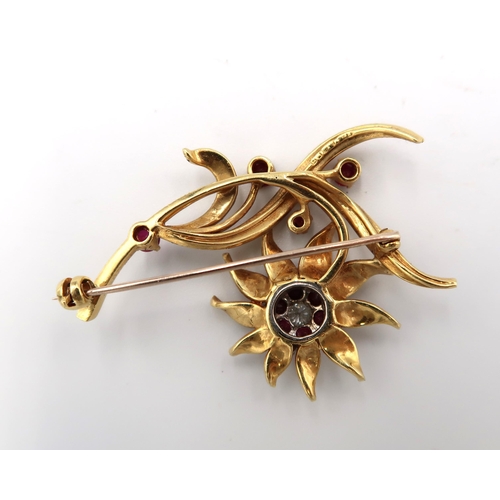  An 18ct hallmarked yellow gold foliate decorated brooch, cluster of garnets and diamonds to central ... 