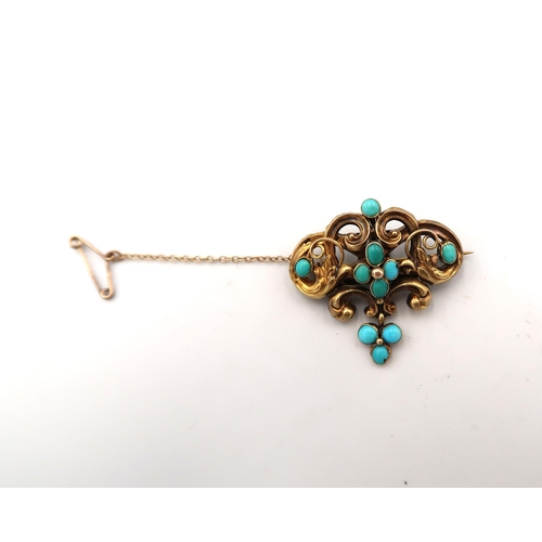  A tested 18ct yellow gold and turquoise set bar brooch of scrolling foliate form, approx 5.4 grams, ... 