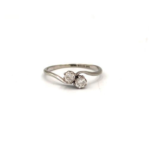  A brilliant cut diamond two stone crossover ring. Estimated total diamond weight 0.40ct, G/H colour,... 