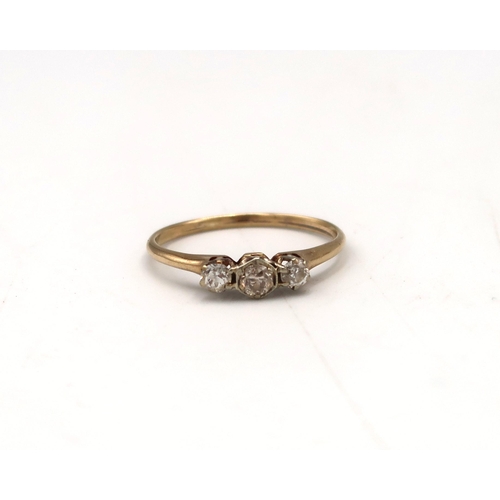  A brilliant cut diamond three stone ring. Estimated 0.40ct total weight I/J, SI1-I2 clarity. Stamped... 