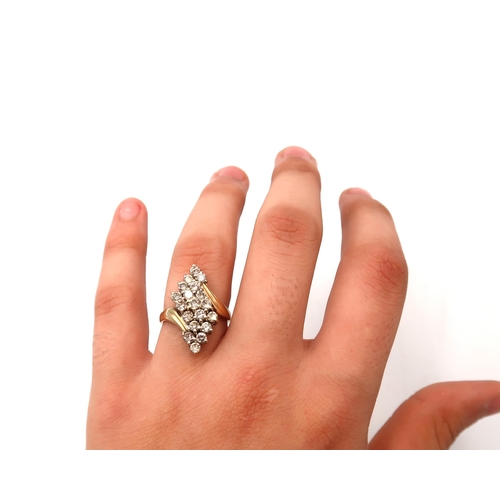  A brilliant cut diamond crossover brilliant cut diamond dress ring cluster. Estimated total weight 1... 