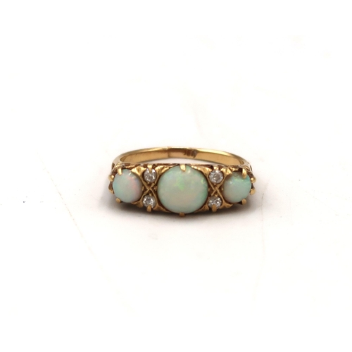  An opal cabochon and old cut diamond boat shape ring. Stamped 18ct. Split to band, requires repair. ... 