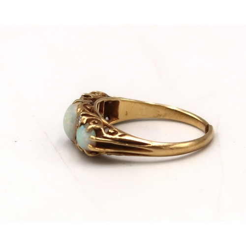  An opal cabochon and old cut diamond boat shape ring. Stamped 18ct. Split to band, requires repair. ... 