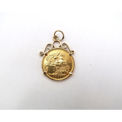  A 1900 Victorian full sovereign in a yellow metal mount, total weight 10.8g.