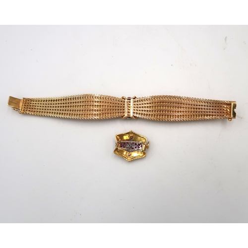  An Art Deco style tapered woven bracelet with central ruby and diamond cluster. Together with a matc... 