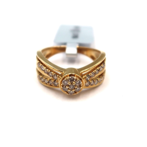 109 - A 9ct gold pave set diamond cluster ring with tapered shoulders. Stated diamond weight 0.50ct. Size ... 