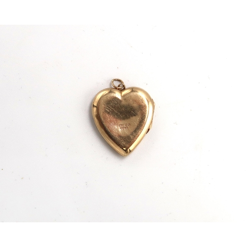 115 - A 9ct hallmarked yellow gold heart shaped locket, approx 2.4 grams