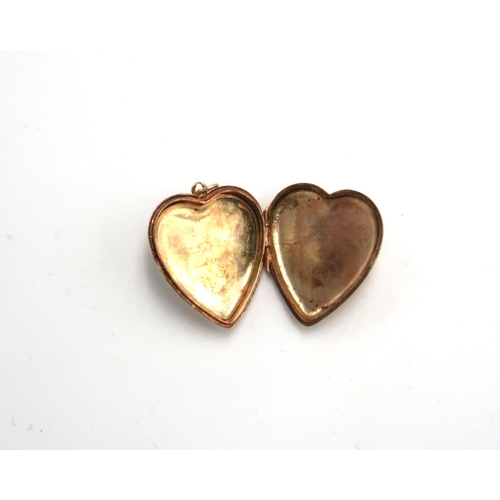 115 - A 9ct hallmarked yellow gold heart shaped locket, approx 2.4 grams