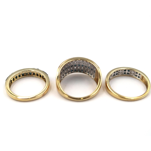 123 - Three 9ct gold rings. To include a two row irradiated blue brilliant cut diamond ring. Stated diamon... 