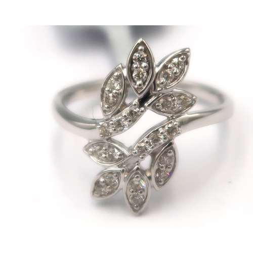 125 - A 9ct gold leaf crossover ring set with brilliant cut diamonds. Stated diamond weight 0.25ct. Size M... 