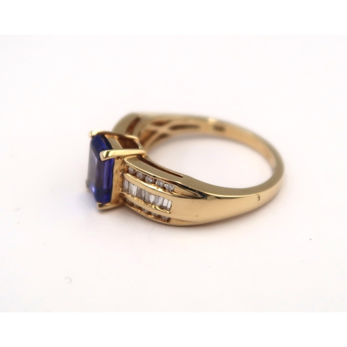 140 - An 18ct yellow gold tanzanite and diamond ring - tanzanite is approx 1.75ct and a very good colour, ... 