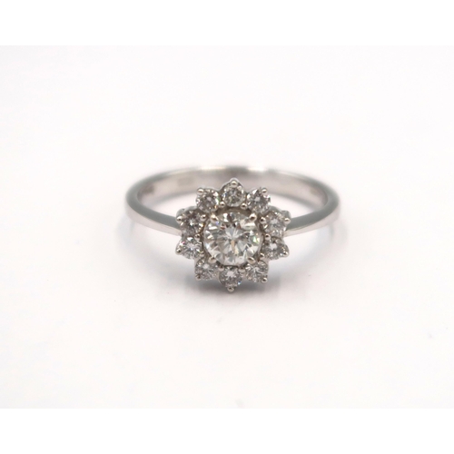 143 - A good quality 18ct white gold diamond cluster ring - colour approx F/G, SI1 - diamonds are well mat... 