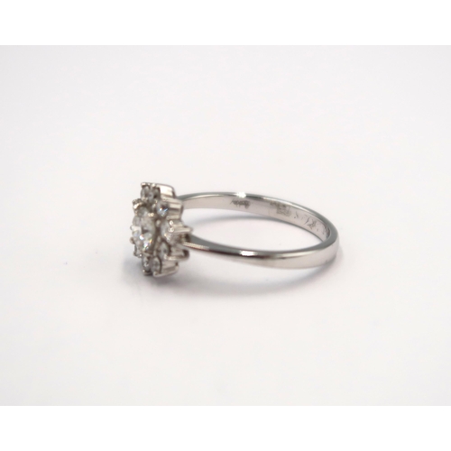 143 - A good quality 18ct white gold diamond cluster ring - colour approx F/G, SI1 - diamonds are well mat... 