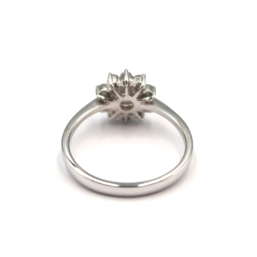 143 - A good quality 18ct white gold diamond cluster ring - colour approx F/G, SI1 - diamonds are well mat... 