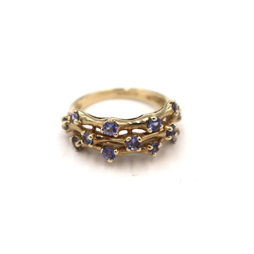 144 - A 9ct yellow gold three row tanzanite ring - head size approx 20mm x 8mm - ring size approx K