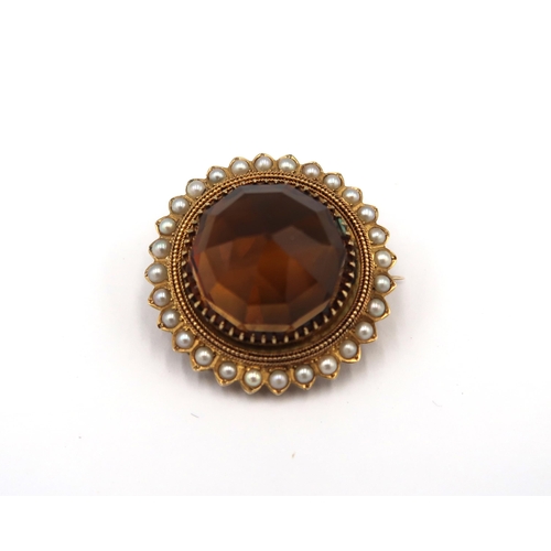 156 - A Victorian gold (tested) citrine and pearl brooch - head size approx 29mm diameter