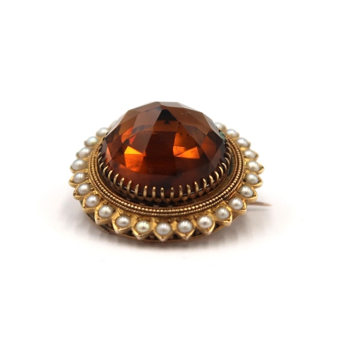 156 - A Victorian gold (tested) citrine and pearl brooch - head size approx 29mm diameter