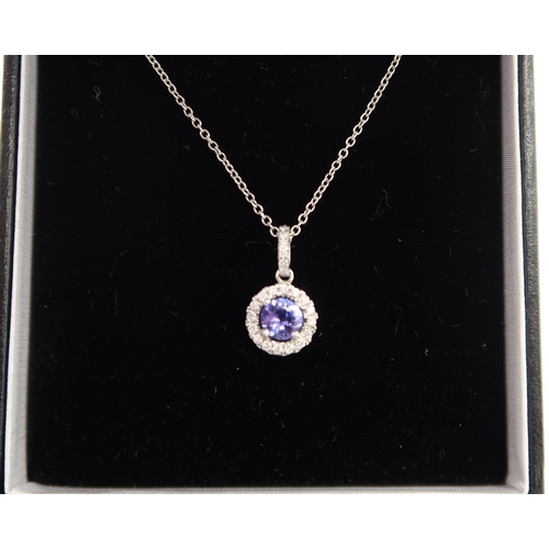 159 - A quality platinum sapphire and diamond pendant on a platinum chain - sapphire and diamonds are a go... 