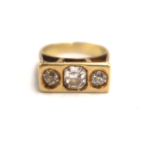 161 - An 18k marked yellow gold three stone diamond ring size L/M - weight approx 6.3 grams - the central ... 