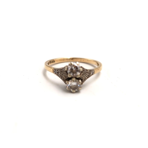 164 - An 18ct marked two stone diamond ring size O - approx weight 3 grams - the two diamonds approx 4mm d... 