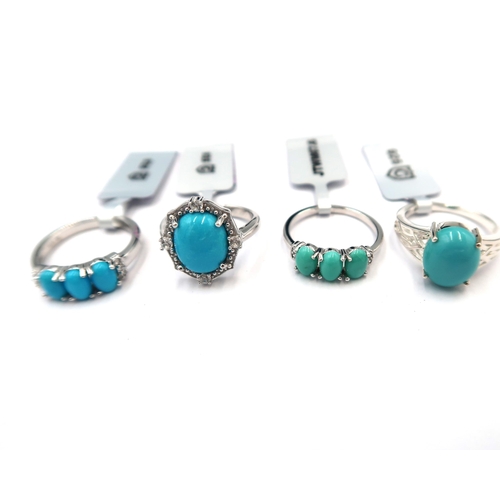 167 - Eight pieces of silver turquoise jewellery. To include two three stone rings with white zircon highl... 