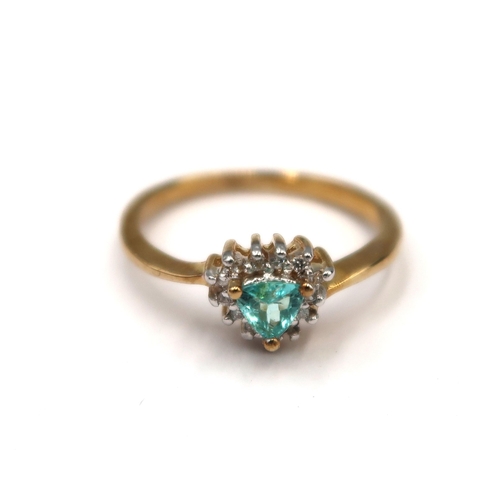 186 - A 9ct gold trilliant cut Paraiba tourmaline and brilliant cut diamond cluster ring. Size N 1/2. Weig... 