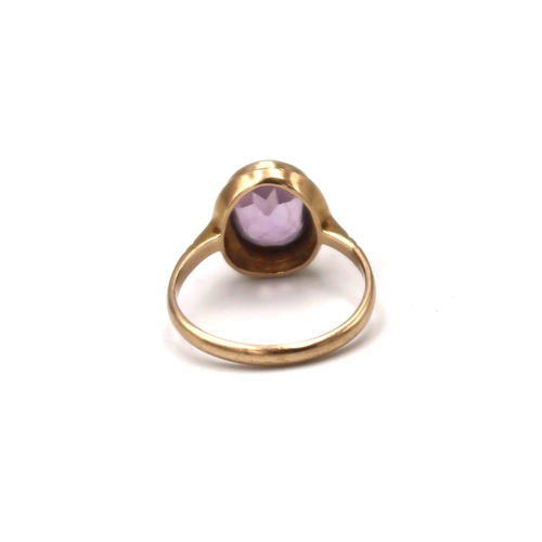 199 - A vintage 9ct gold and amethyst set dress ring, size L, 2.5g.