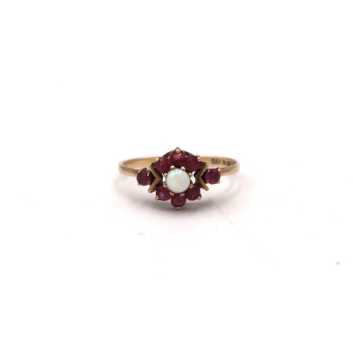 202 - A 9ct gold, opal and garnet set flowerhead ring, size J, 1.4g