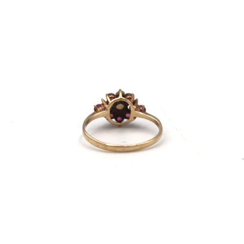 202 - A 9ct gold, opal and garnet set flowerhead ring, size J, 1.4g