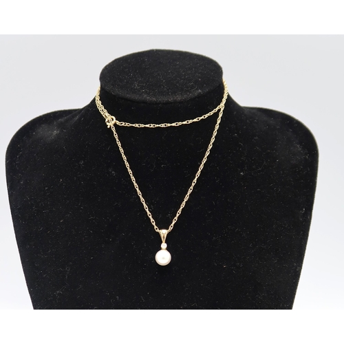 207 - A 14K marked, pearl and diamond pendant on a, hallmarked 9ct, gold chain 44cm long.