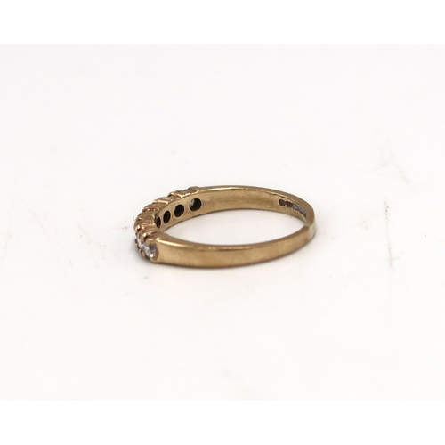 209 - A 9ct gold half eternity ring, set with 0.33ct diamonds, hallmarked, size K, approx weight 1.6g