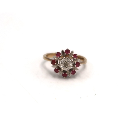 214 - A 9ct gold ruby and diamond cluster ring, hallmarked, size P/Q, 2.8g.