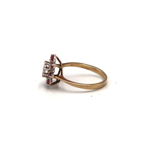 214 - A 9ct gold ruby and diamond cluster ring, hallmarked, size P/Q, 2.8g.