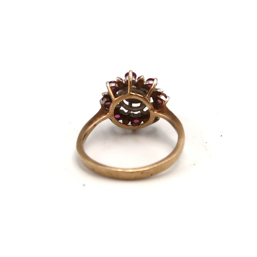 214 - A 9ct gold ruby and diamond cluster ring, hallmarked, size P/Q, 2.8g.