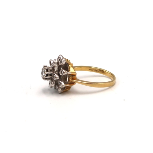 215 - An 18ct gold and diamond cluster ring with flower head design, with illusion set central, round cut,... 