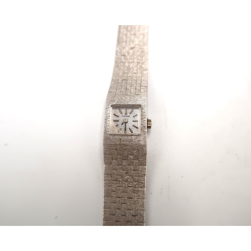 277 - A Tissot white metal ladies watch, working in saleroom and with box, with purchase papers and spare ... 